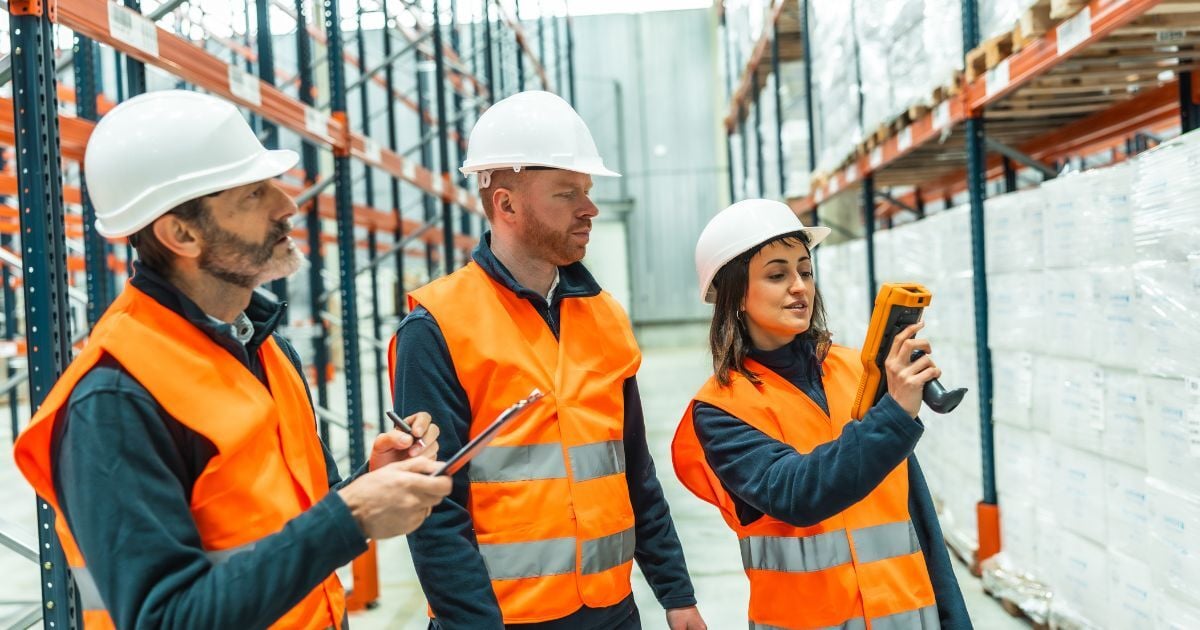 Warehouse team with digital scanner
